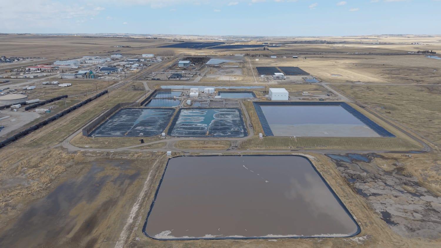 Cesspool waste lagoon at at Alberta beef feedlot.